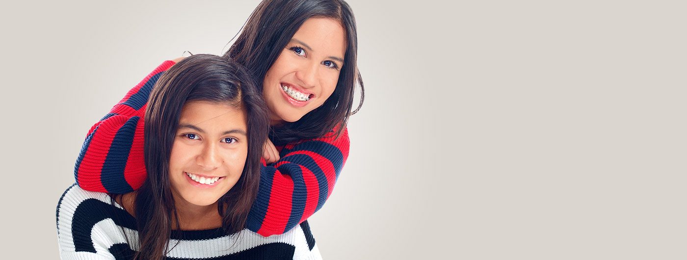 Two young girls one with braces