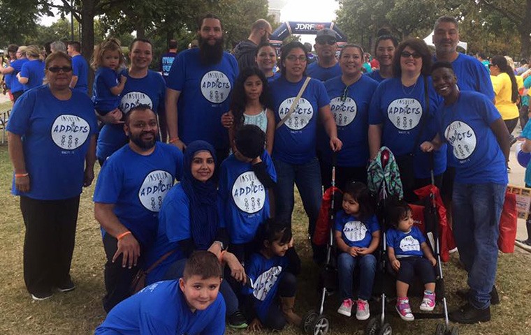 Team wearing matching shirts at community event