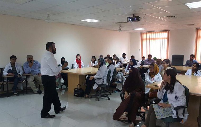 Dr. Athar giving presentation