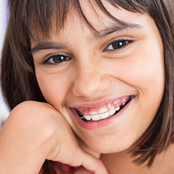 Young girl with orthodontic appliance