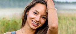 Young woman with tooth-colored braces